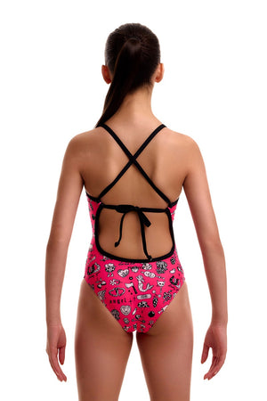 Pink, black, and white Funkita girls' sketchy tie-me-tight one-piece swimsuit displayed on a girl.
