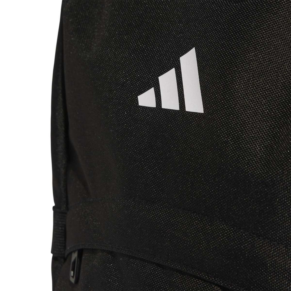 Black Adidas TIRO backpack with sleek design, adjustable straps, and multiple compartments for sports and everyday use.
