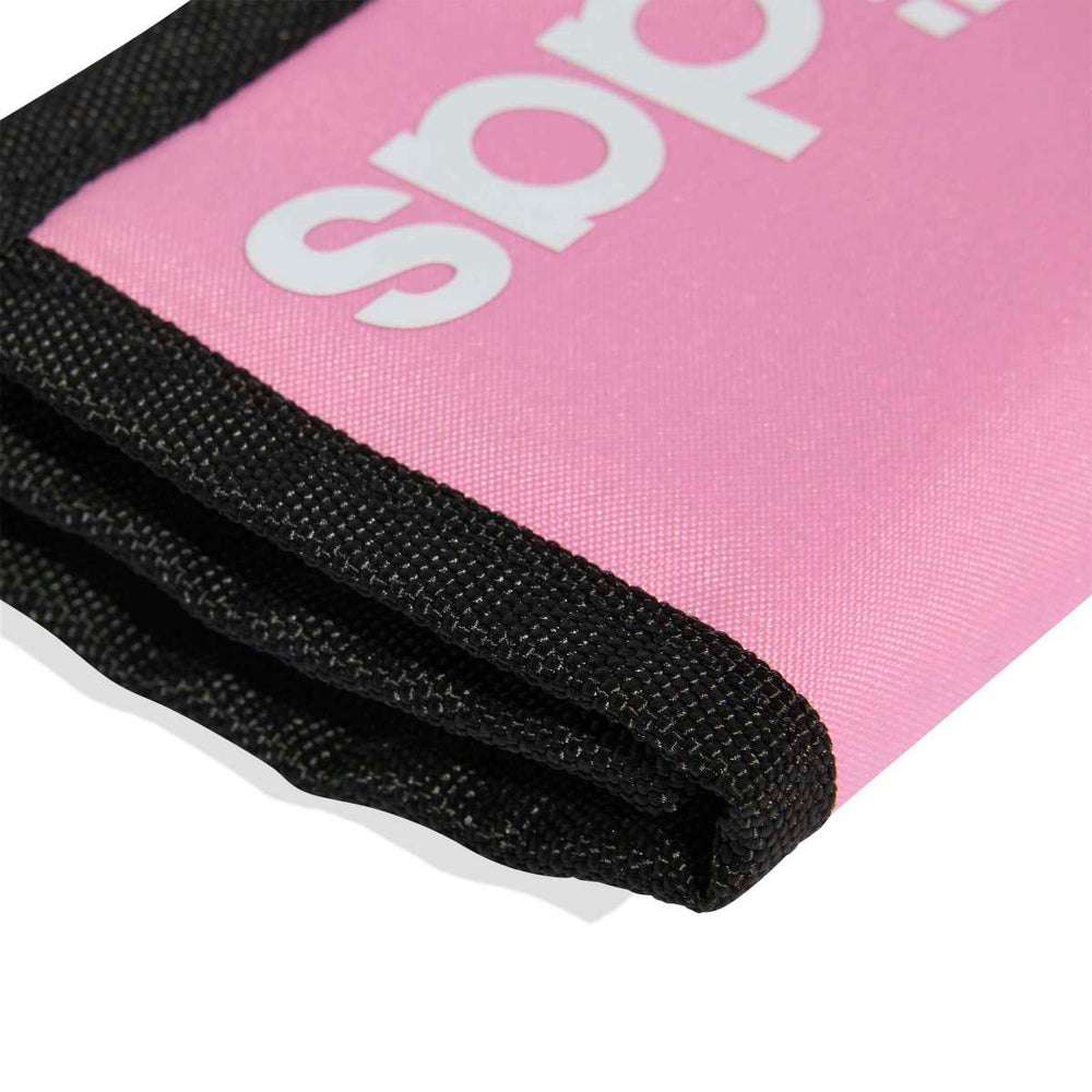 Adidas pink and white linear wallet with hardware details, showing zipper and logo on a clean background.