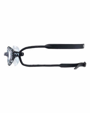 TYR Nest Pro swimming goggles in smoke color with adjustable straps and clear lenses for competitive or recreational swimming.