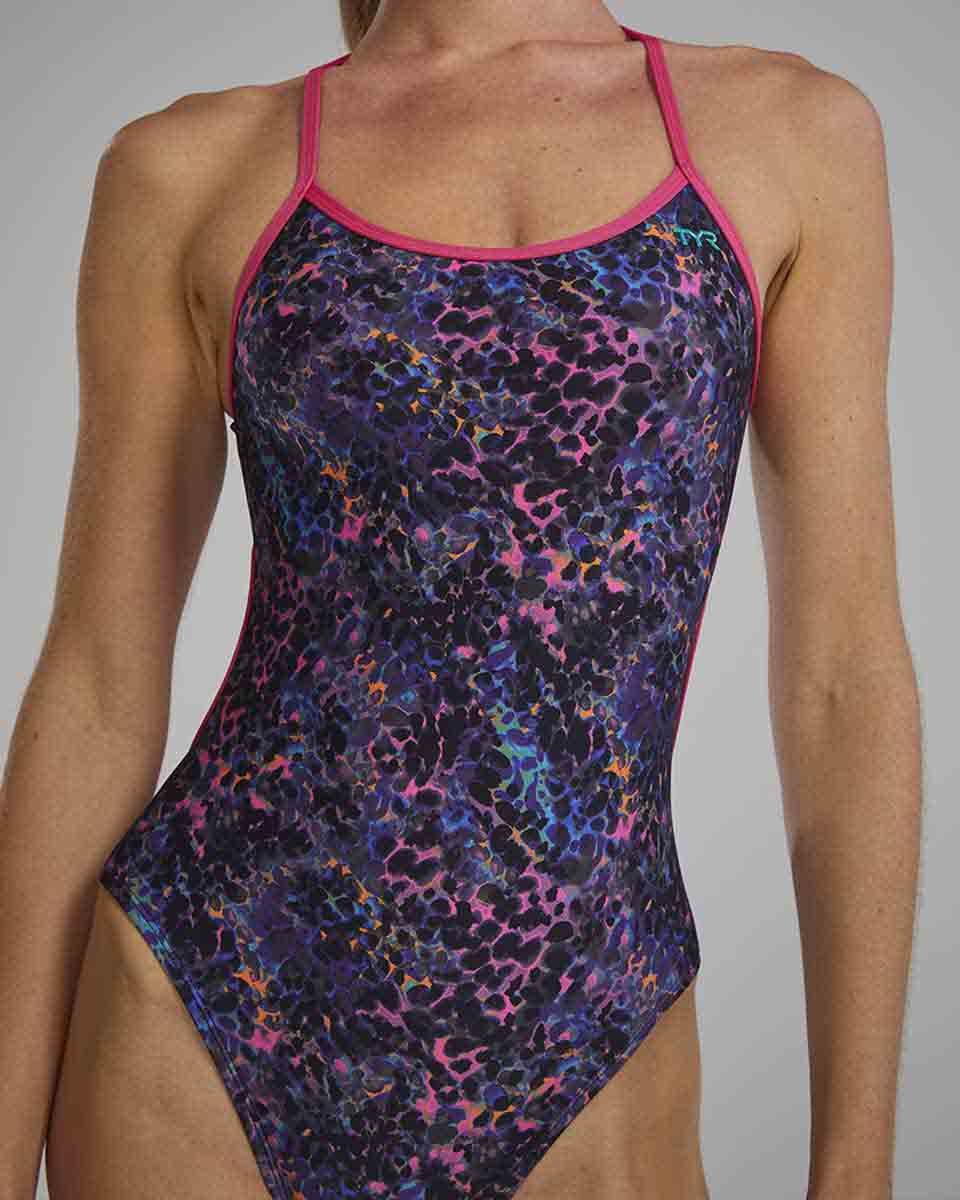 TYR women's Stipple Trinityfit swimsuit in petunia color, featuring a sleek, form-fitting design with adjustable straps and stylish pattern.