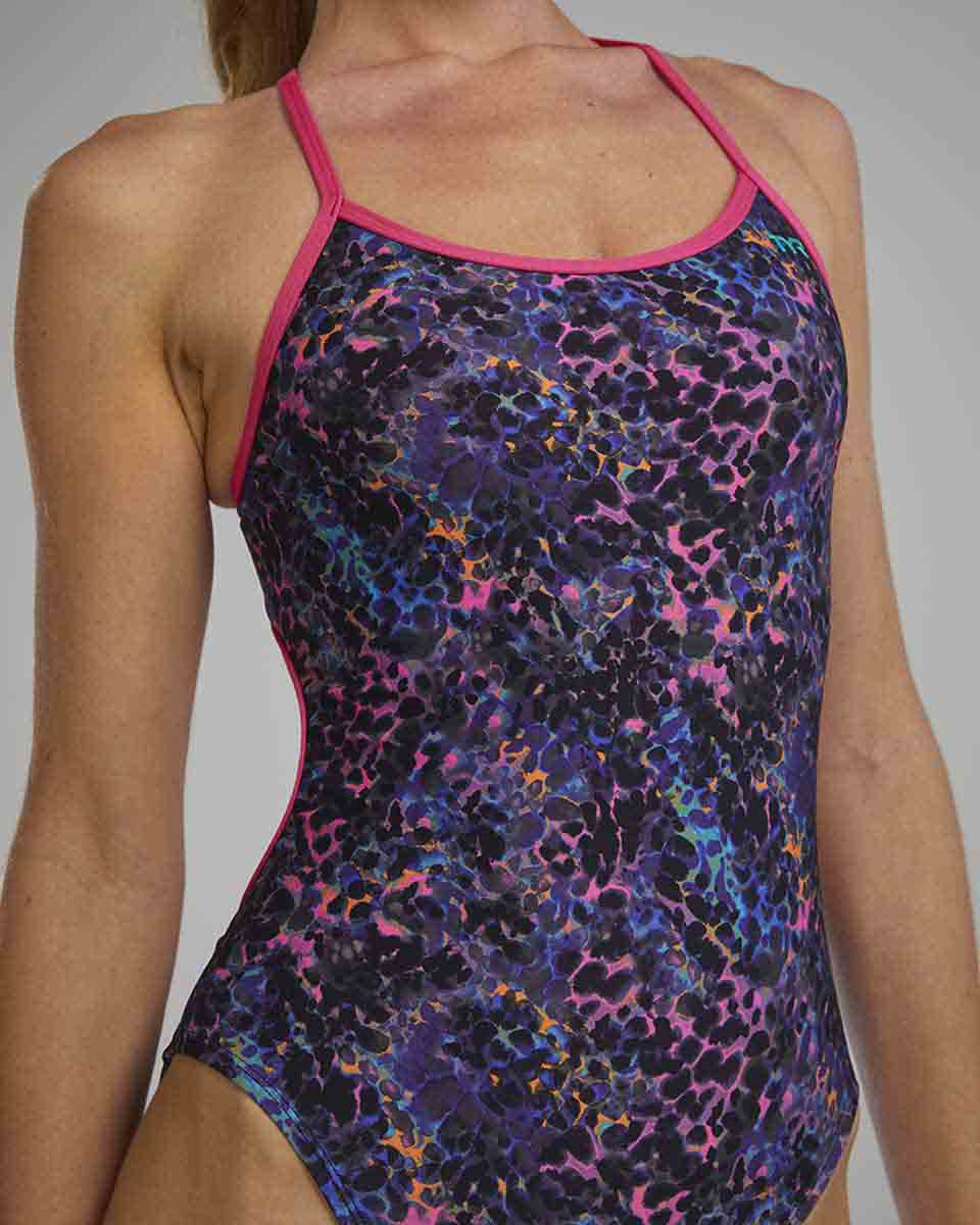 TYR Women's Stipple Trinityfit Swimsuit in Petunia, featuring a vibrant purple design with sleek straps and sporty fit.
