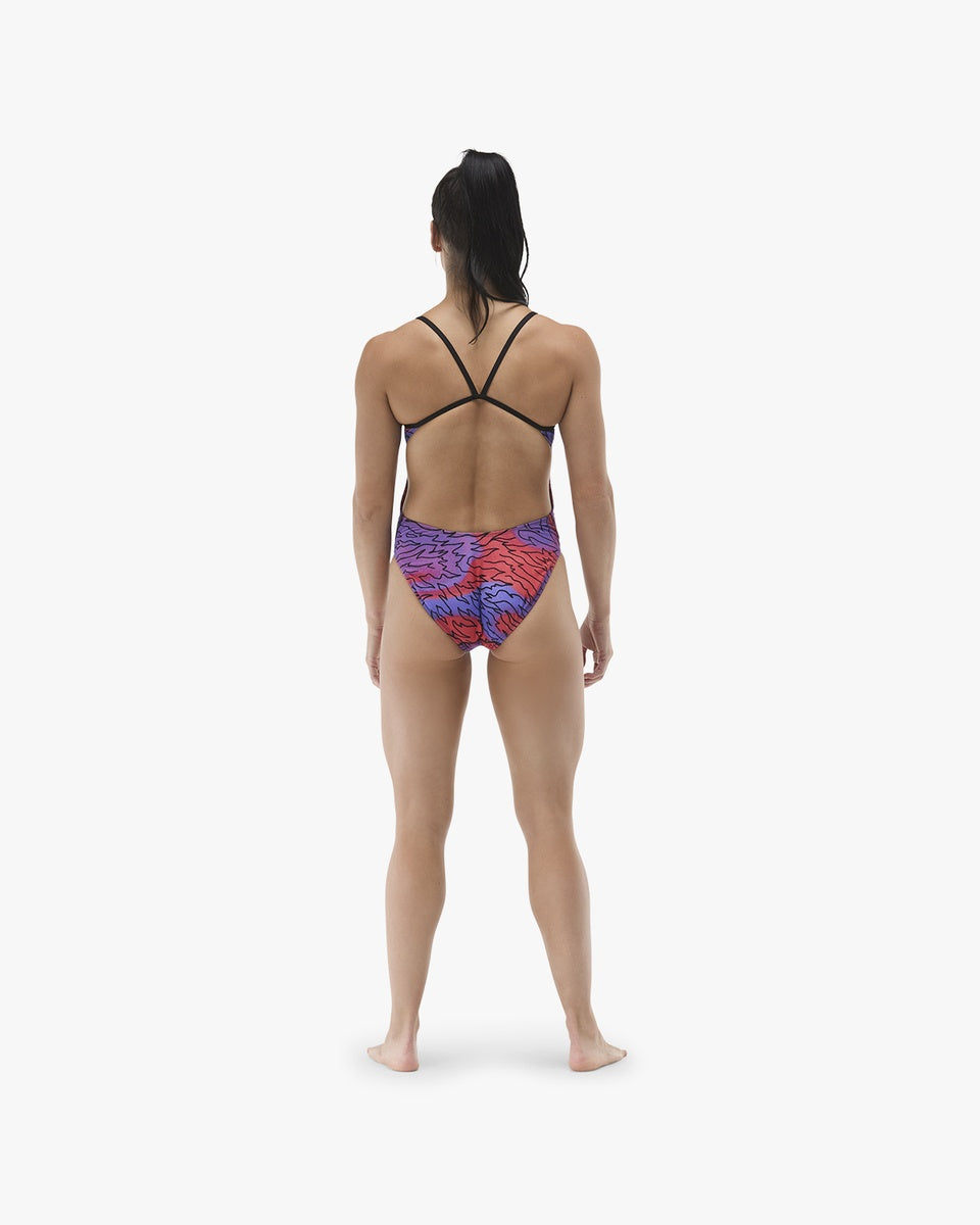 TYR women's Hodori Cutoutfit swimsuit in orange and purple with stylish cutouts, designed for competitive and leisure swimming.