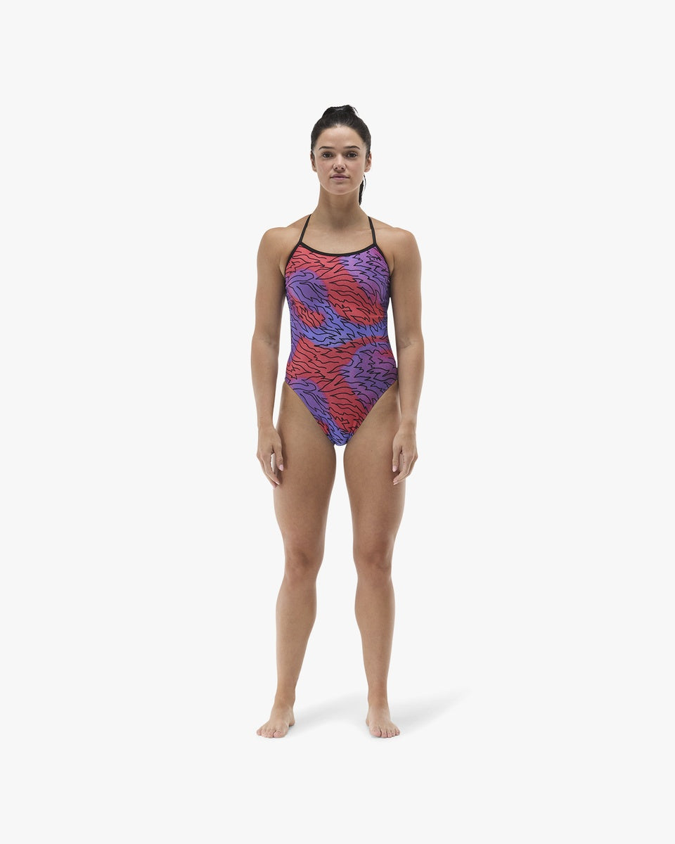 TYR Women's Hodori Trinityfit swimsuit in orange and purple with a sleek, sporty design for swimming and water activities.
