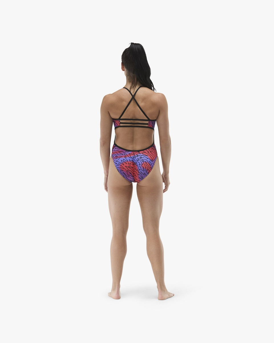 TYR women's Hodori Trinityfit swimsuit in orange and purple, featuring a sleek, supportive design for competitive swimming.