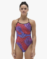 TYR women's Hodori Trinityfit swimsuit in orange and purple, featuring sleek design and supportive fit for competitive swimming.