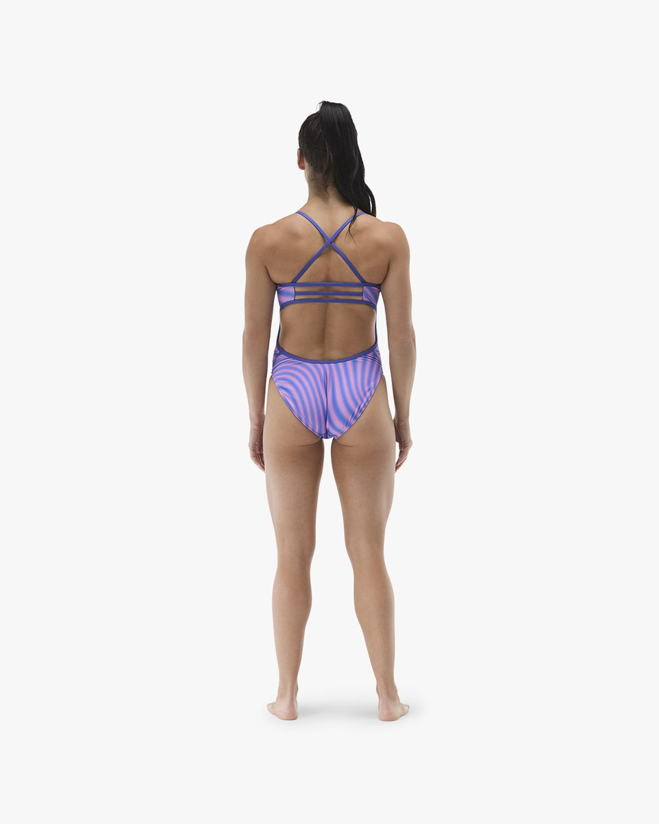 TYR women's Trinityfit swimsuit in blue and pink featuring a sleek, sporty design and supportive fit.