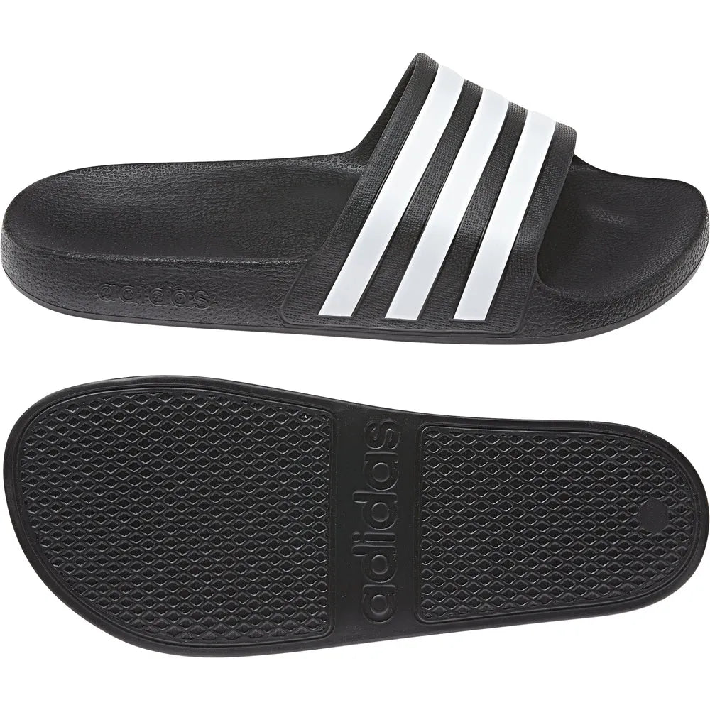 Black Adidas Adilette Aqua Slides worn on feet, showcasing casual slip-on design perfect for sports and beachwear.