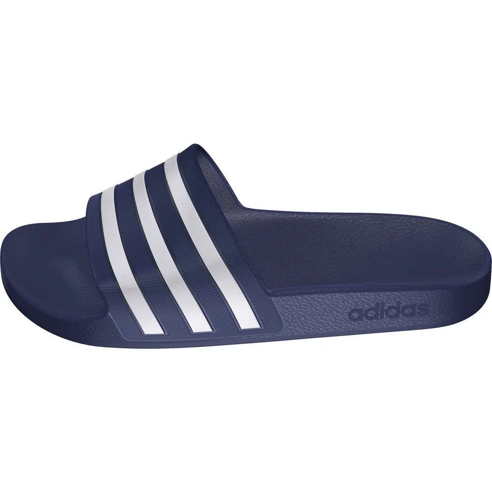 Navy blue Adidas Adilette Aqua slides with open toe design, paired with sports socks, on a plain background.