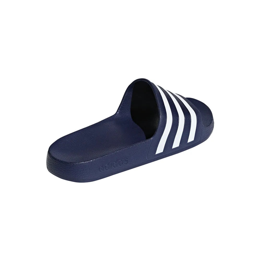 Navy blue Adidas Adilette Aqua slides with open toe design, paired with sports socks, on a white background.