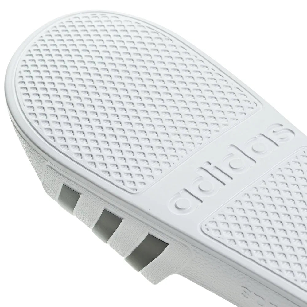 White Adidas Adilette Aqua slides with sporty design, ideal for casual wear and water activities.