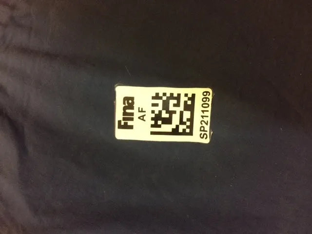 AK race suit repair service, showing a close-up of a repaired racing suit with visible stitching and fabric details.