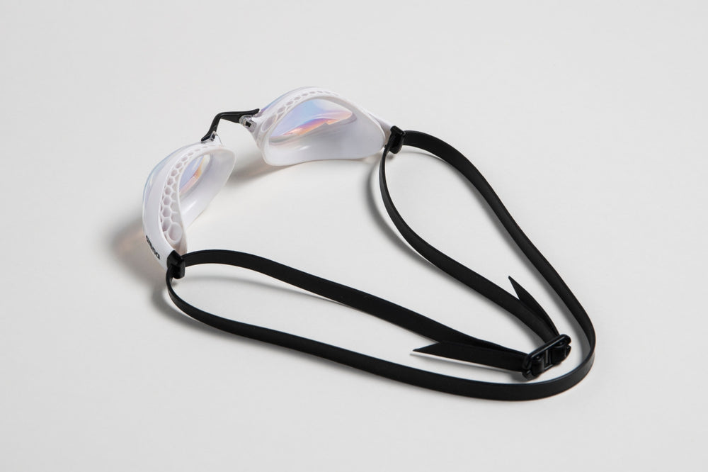 Arena Airspeed Mirror goggles in white and copper with reflective lenses, designed for competitive swimmers.