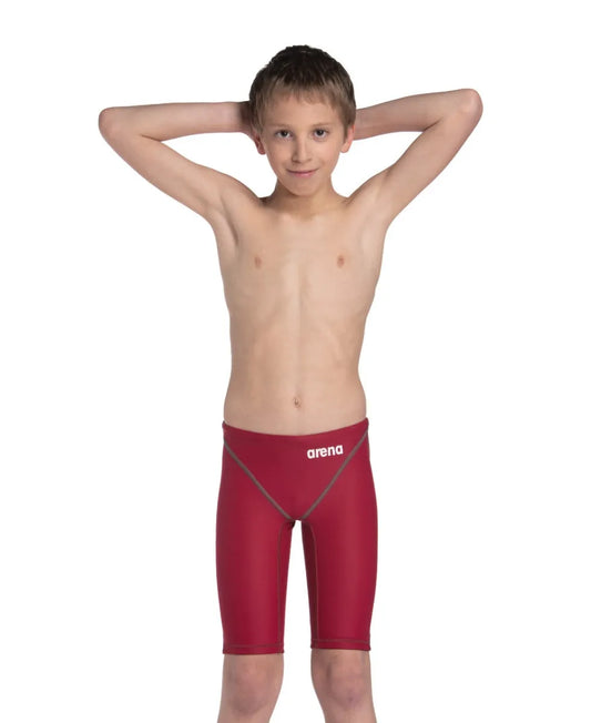 Arena Boys Powerskin ST Next Jammer in deep red, close-up of the competitive swim jammers with sleek fabric and branding details. 981