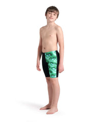 Arena boys' logo graphic swim jammer in black, soft green, and multi-colored design, shown on a young swimmer's body.