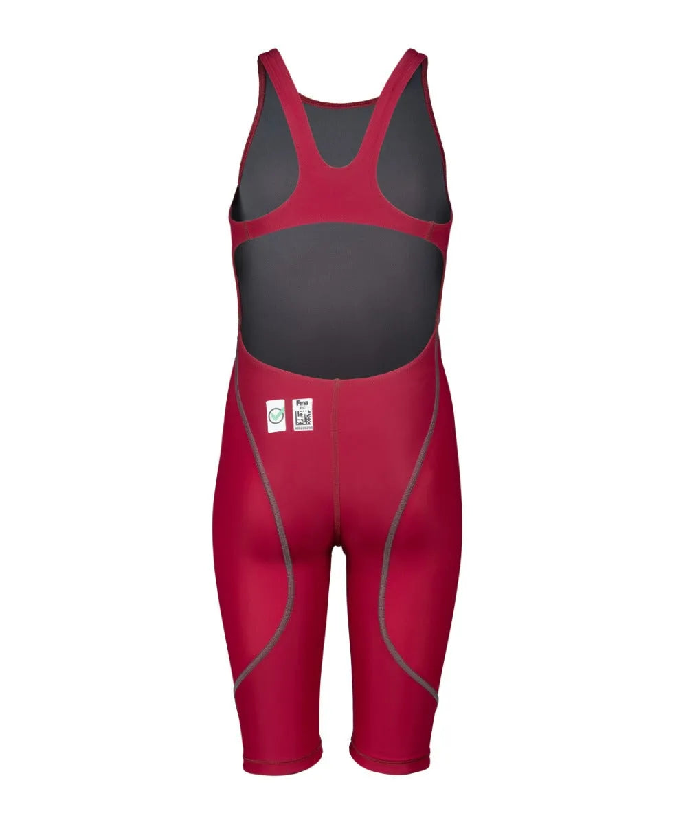 Arena Girls Powerskin ST Next kneesuit in deep red, designed for young swimmers, featuring a sleek, form-fitting suit with a high-performance look.