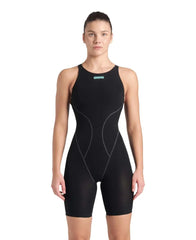 Arena Women's Powerskin Impulso openback kneesuit in black and teal, shown on a model highlighting its sleek design and open back.