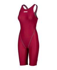 Arena Women's Powerskin ST Next Kneesuit in deep red, featuring sleek design and high-performance fabric for competitive swimming.
