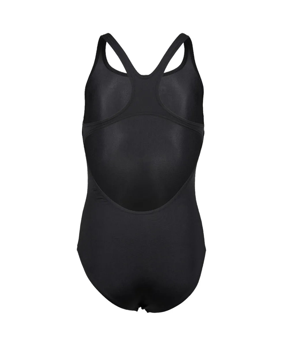 Black Arena Girls Team Swim Pro solid swimsuit displayed on a girl in a pool setting, highlighting sporty design and comfortable fit.