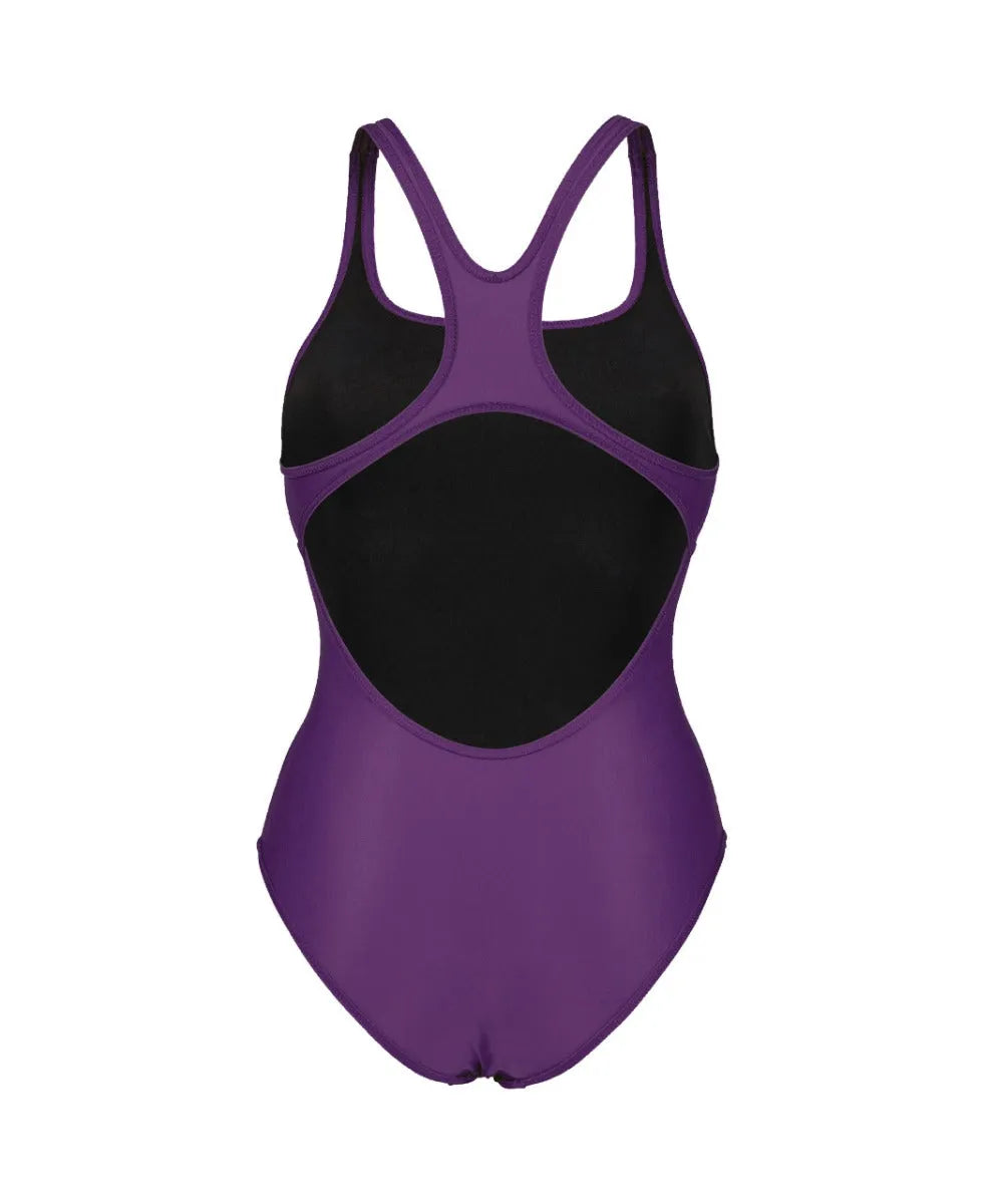 Arena women's solid Team Swim Pro swimsuit in plum and white, featuring a sleek, fitted design perfect for competitive swimming.