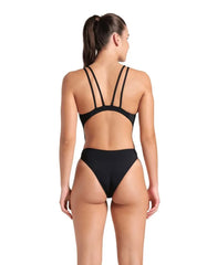 Arena women's solid black and white tech back swimsuit, designed for swimming and training, featuring sleek, durable fabric.