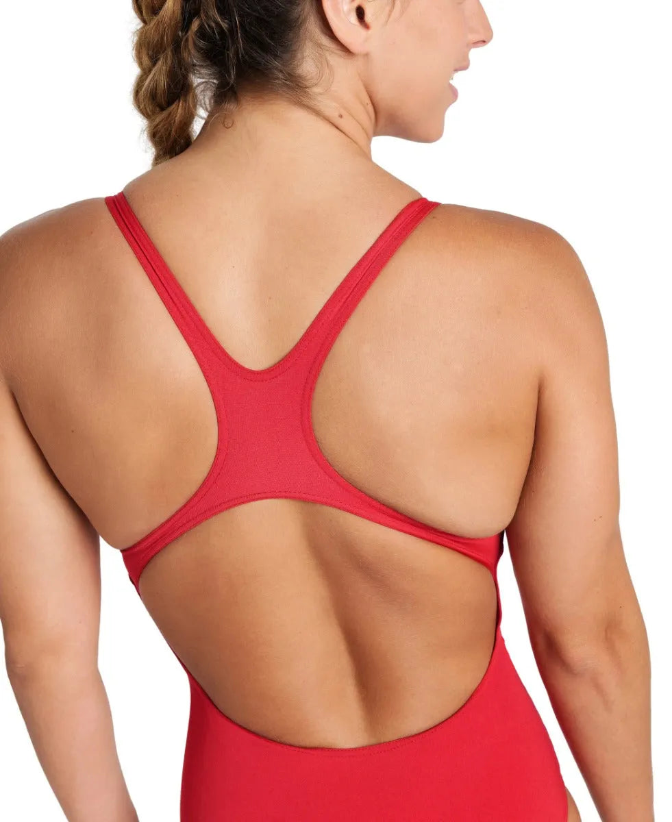 Red Arena Women’s Team Swim Pro Solid Swimsuit displayed on a model, showcasing athletic fit and sleek design for competitive swimming.