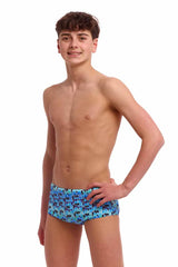 Funky Trunks boys Jack Stack Sidewinder trunks in blue and multi-color with vibrant patterns, designed for swimming and beach activities.