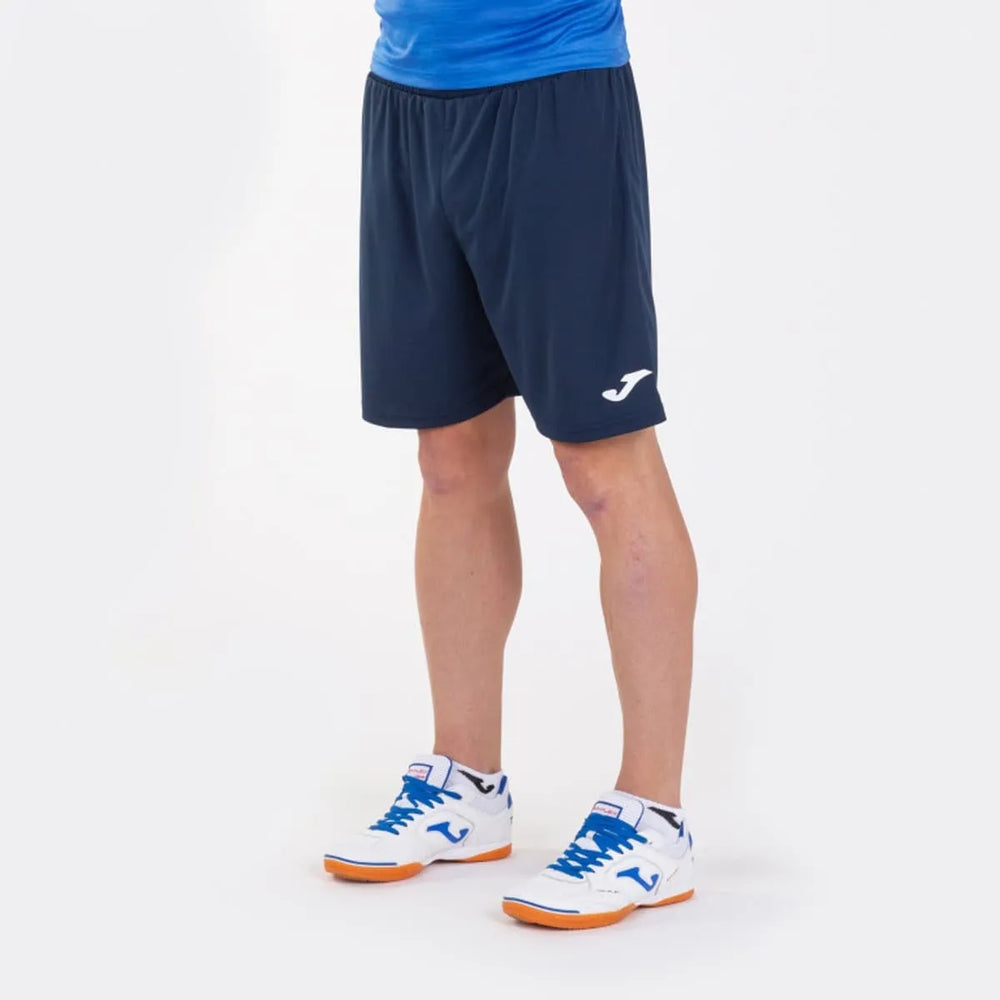 Joma Boys Nobel Short in dark navy, athletic shorts with Joma branding, suitable for sports and casual wear.