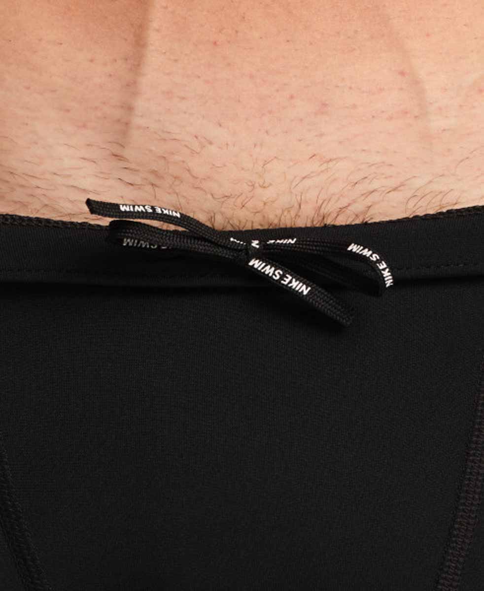 Nike men's Hydrastrong graphic jammer in Jet Black and Energy featuring bold swimwear design and Nike logo on the fabric.
