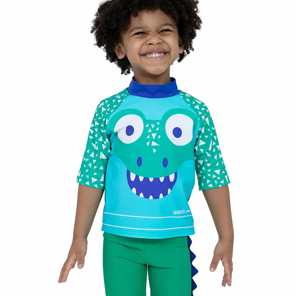 Speedo Corey Croc green swim top and short set for kids, made from rash guard material, designed for active swimming and water play.
