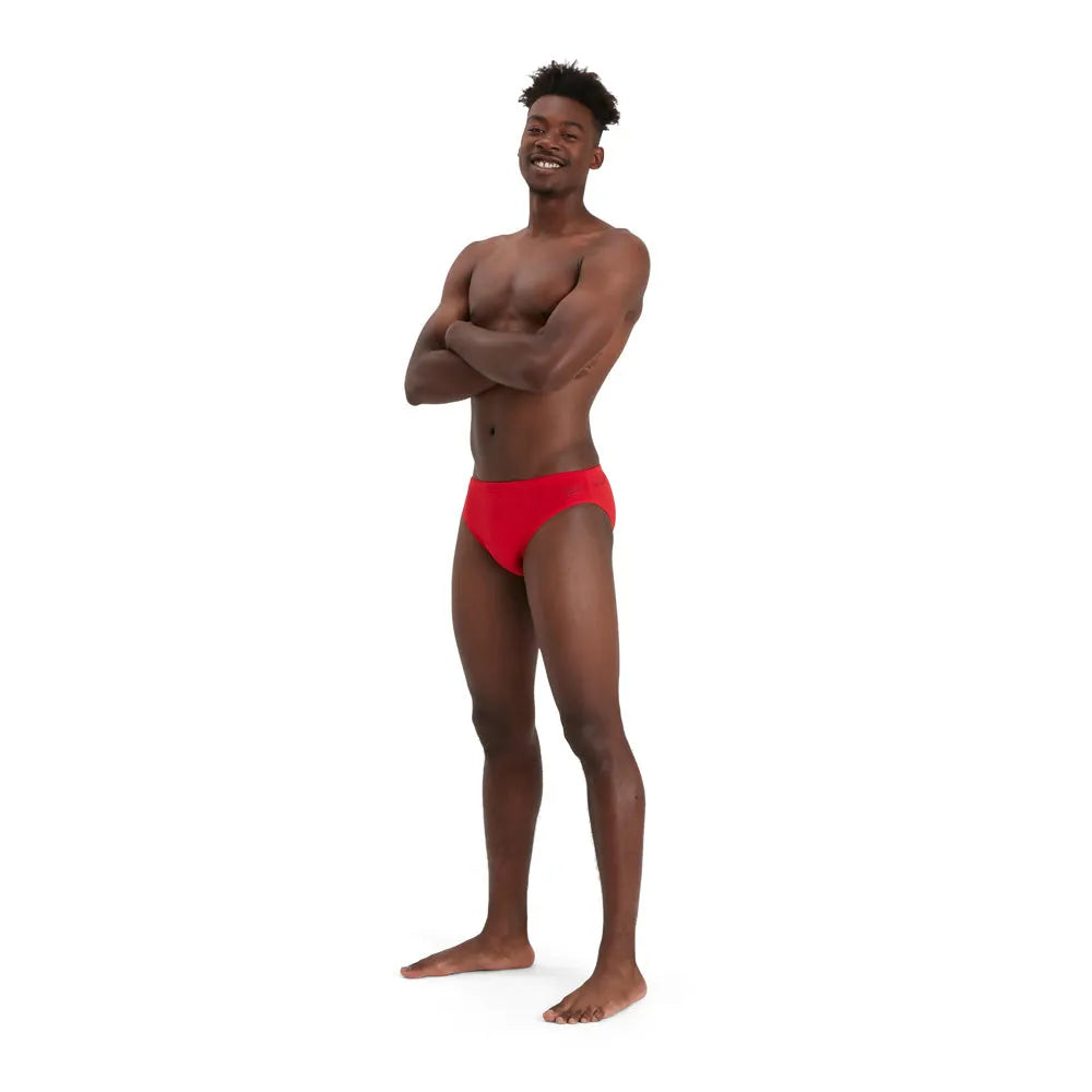 Red Speedo men's Eco Endurance+ 7cm briefs, swimwear with a snug fit and durable fabric, designed for comfortable swimming.
