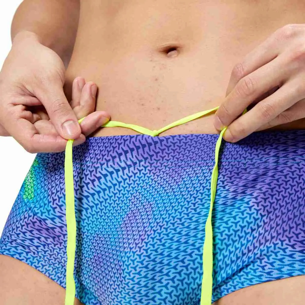 Speedo men's printed 13.5cm briefs in Under Current and Sugar Blue, featuring colorful swimwear design and comfortable fit.