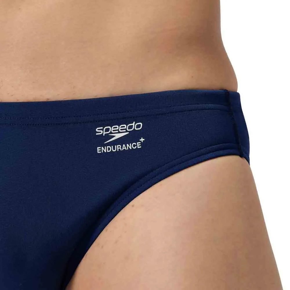 Speedo men's ML solid brief in navy blue, lightweight swimwear with a snug fit, designed for comfort and performance in the water.