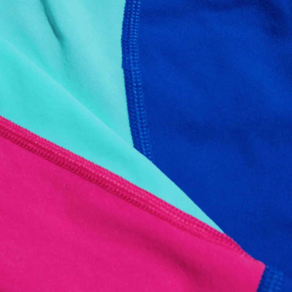 Speedo Fastskin Junior Endurance+ high-waisted jammers in cobalt, green glow, and orchid shine with bold, colorful design.