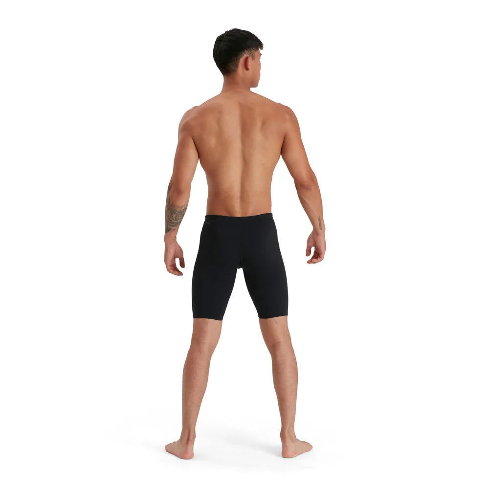 Speedo men's Eco Endurance+ jammer swimwear, close-up showing sleek black design and durable fabric for competitive swimming.