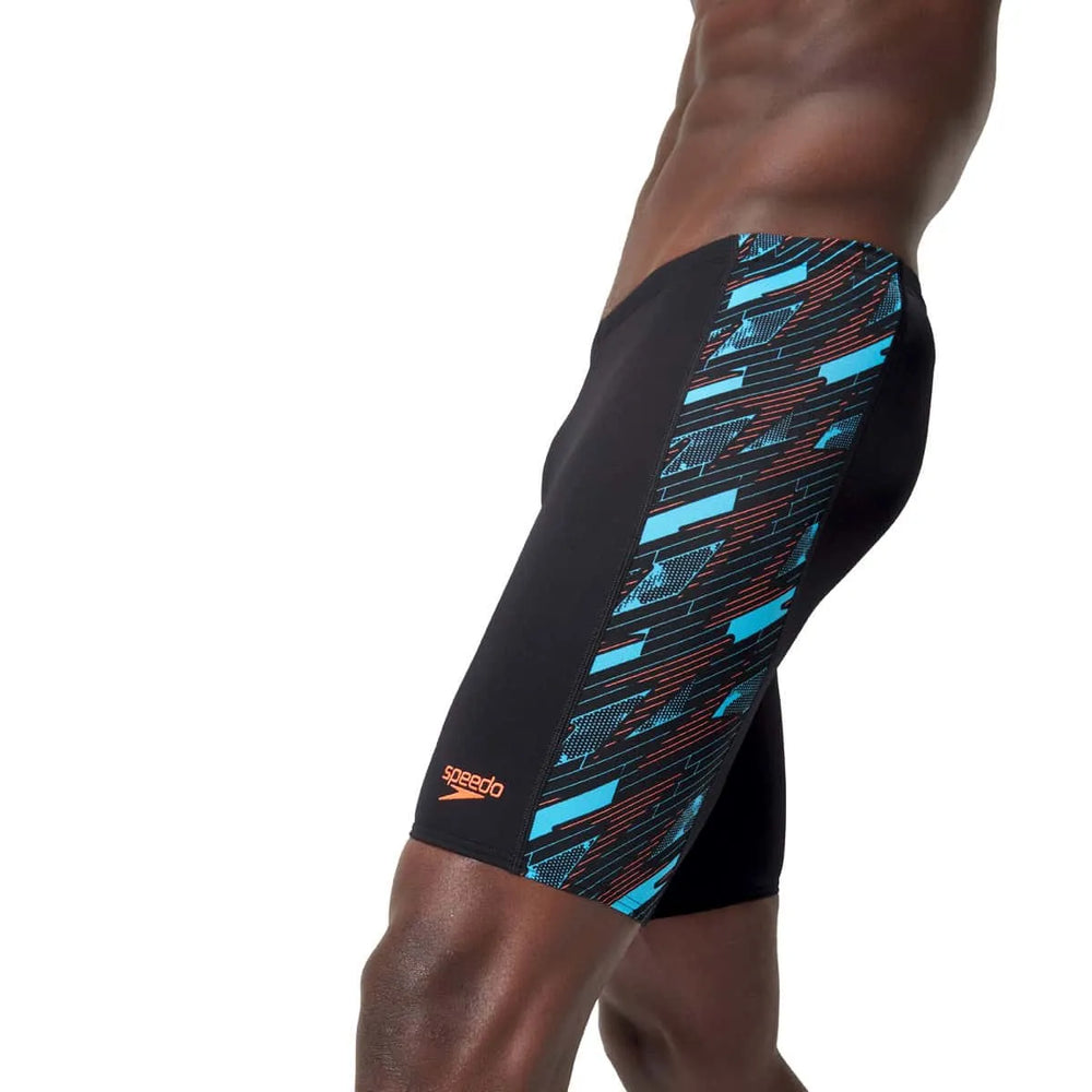 Speedo men's HyperBoom Panel jammer swimsuit in black, Picton Blue, and Siren Red with stylish panel design.