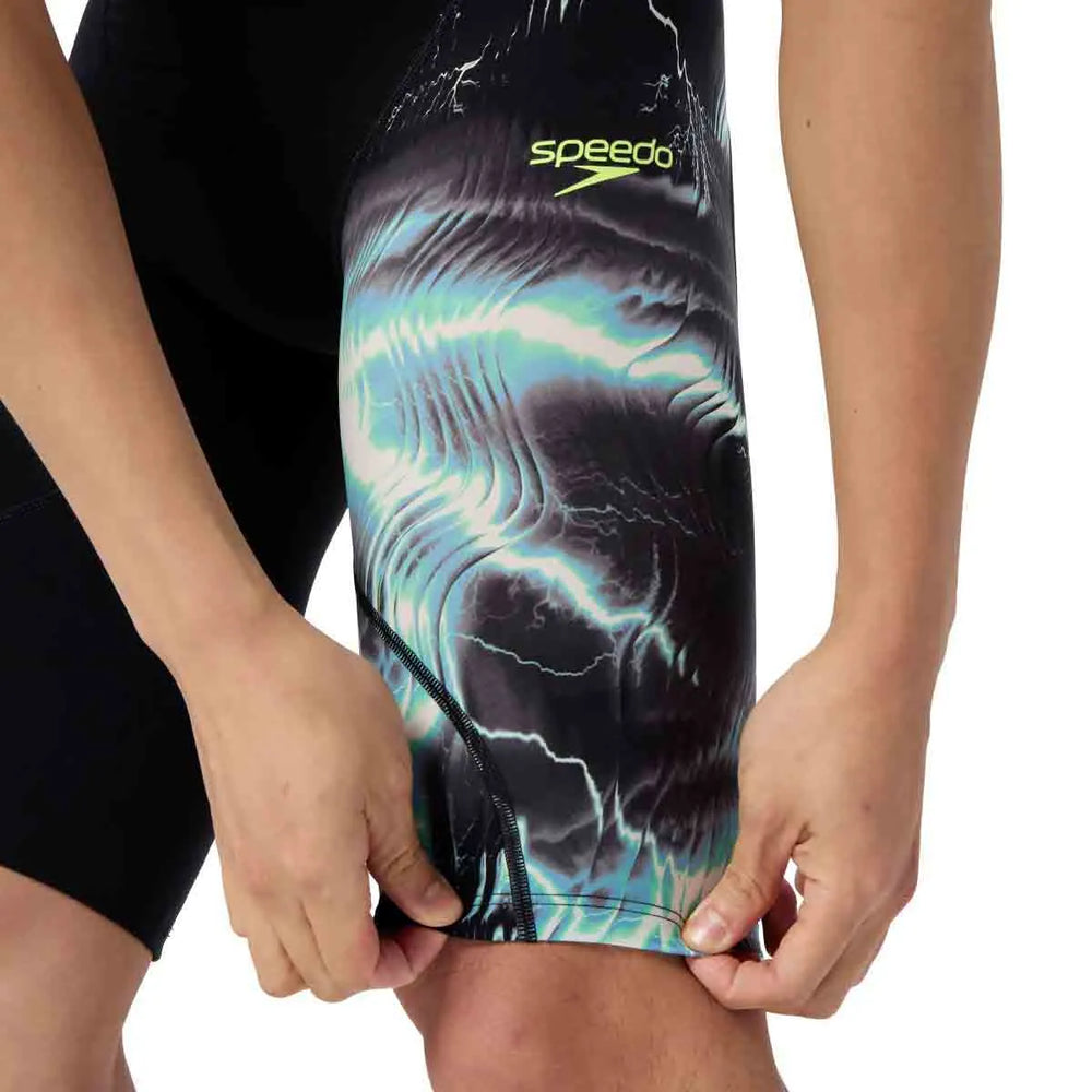 Speedo men's Fastskin LZR Ignite jammer in black and electro static design, close-up of the swimwear fabric and fit.