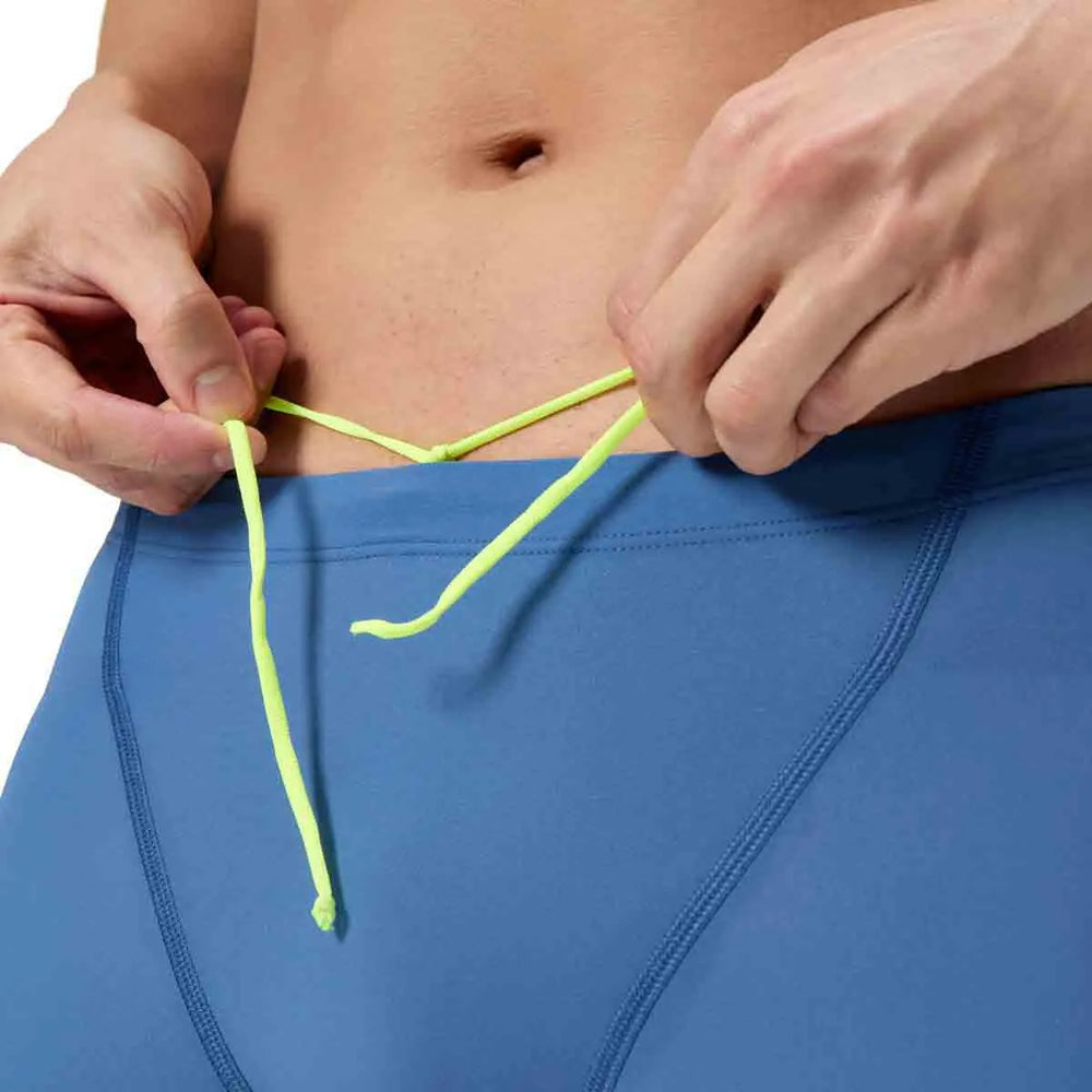 Speedo men's Fastskin LZR Ignite jammer in Nite and Acadia Blue, close-up view of the fitted swimwear for competitive swimming.