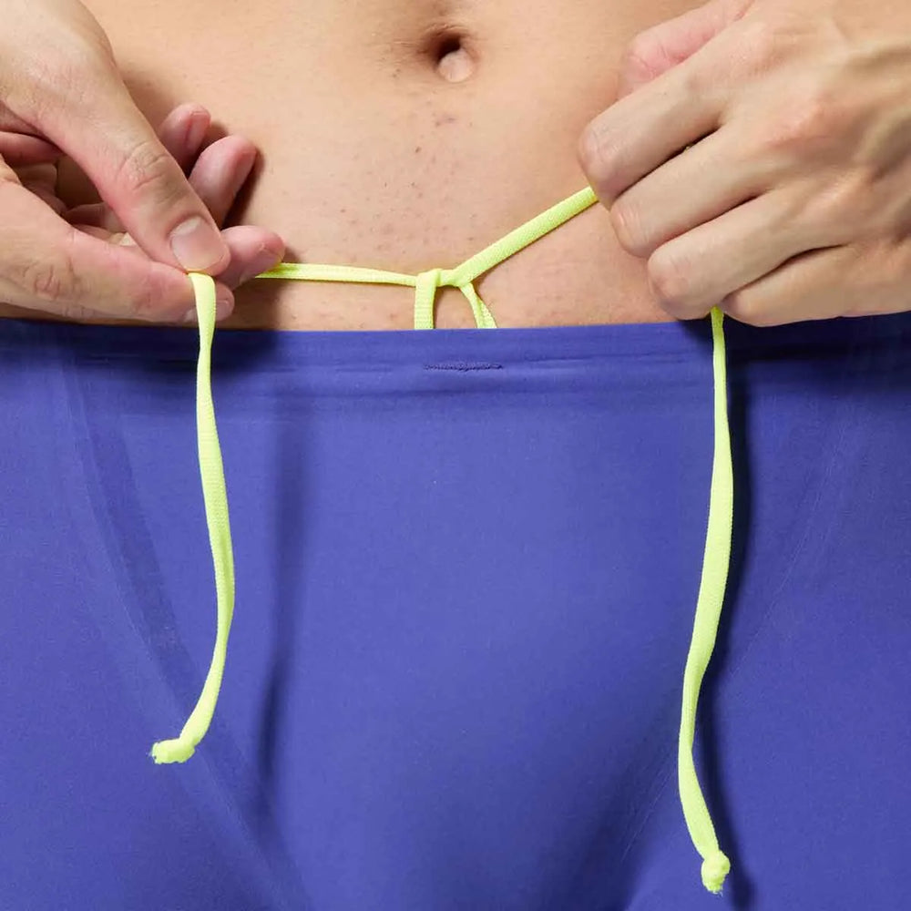 Speedo men's Fastskin LZR Pure Intent 2.0 purple jammers, tight-fitting swimwear for competitive swimming, shown on a model.