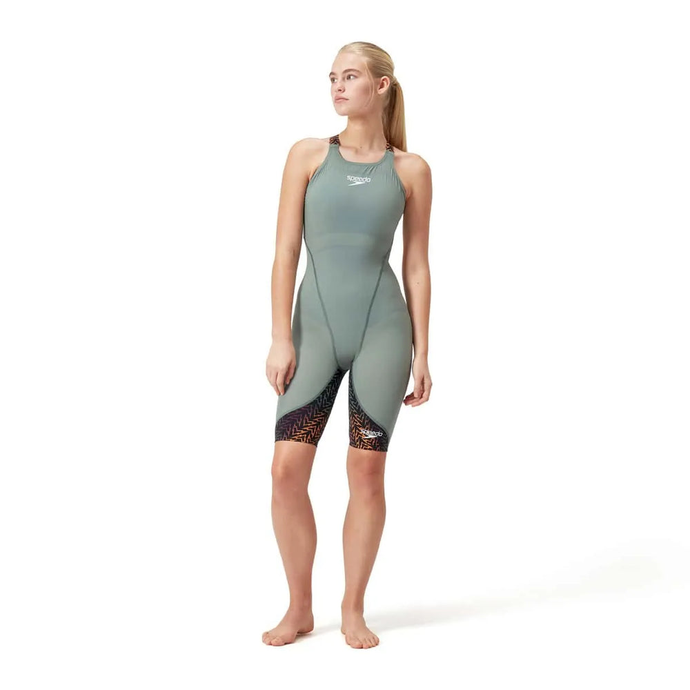 Speedo Women's Fastskin LZR Ignite Kneeskin in green and orange, close-up of the fitted swimkneesuit with Speedo branding.