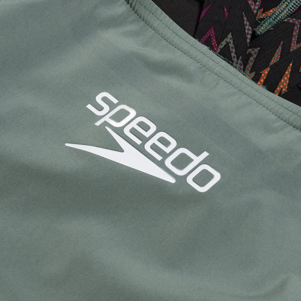 Speedo Women's Fastskin LZR Ignite Kneeskin in green and orange, close-up view of the sleek, fitted swimsuit for competitive swimming.