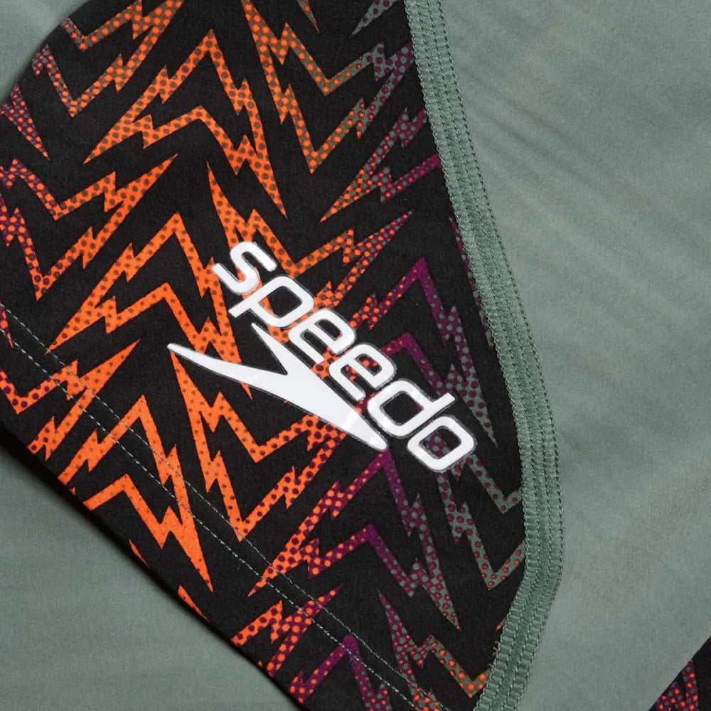 Speedo Women's Fastskin LZR Ignite Kneeskin in green and orange, close-up of sleek swimwear with streamlined design.