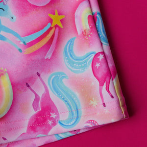 Speedo girls' short sleeve printed rash top set in pink and blue, perfect for swimming and sun protection.